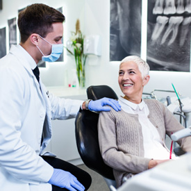 Patient smiling at dentist during routine visit